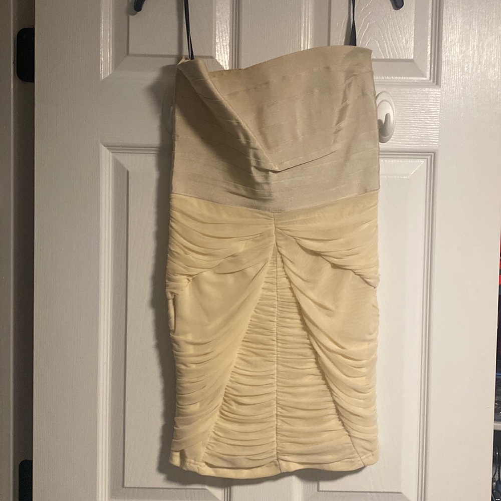 Bebe mini beige dress size M stretchy material top and bottom.